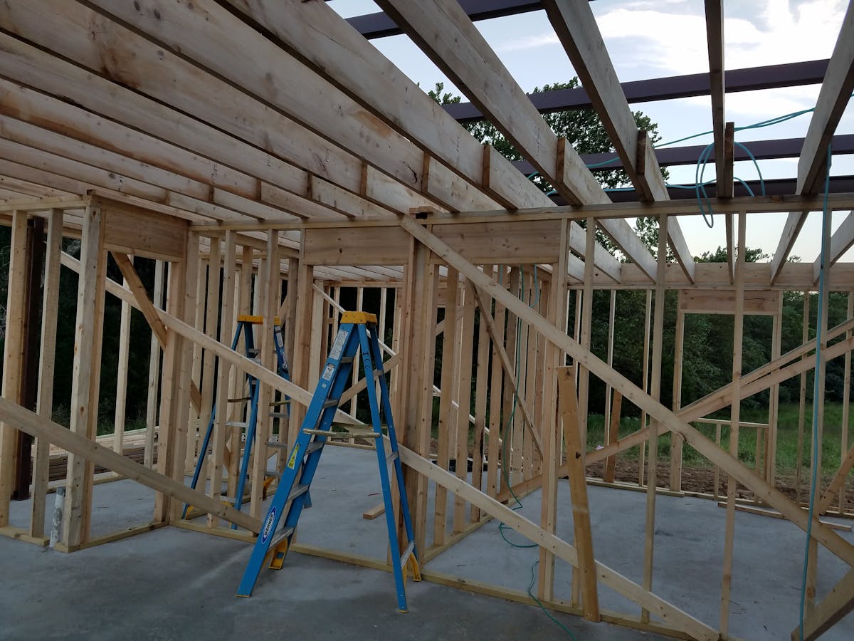 New home construction framing with wooden beams
