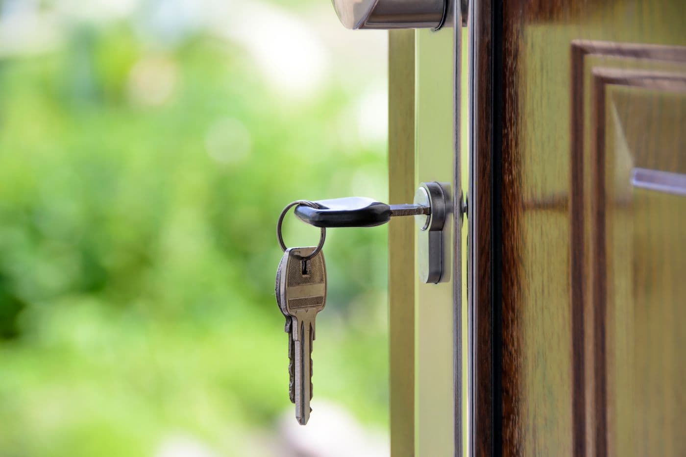 House keys in the front door of a new home